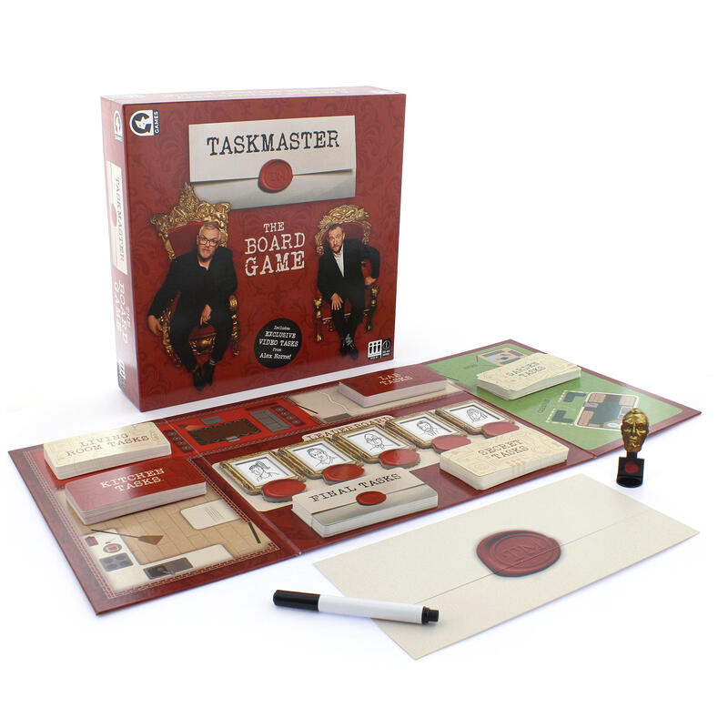 Taskmaster board game contents laid out on white background